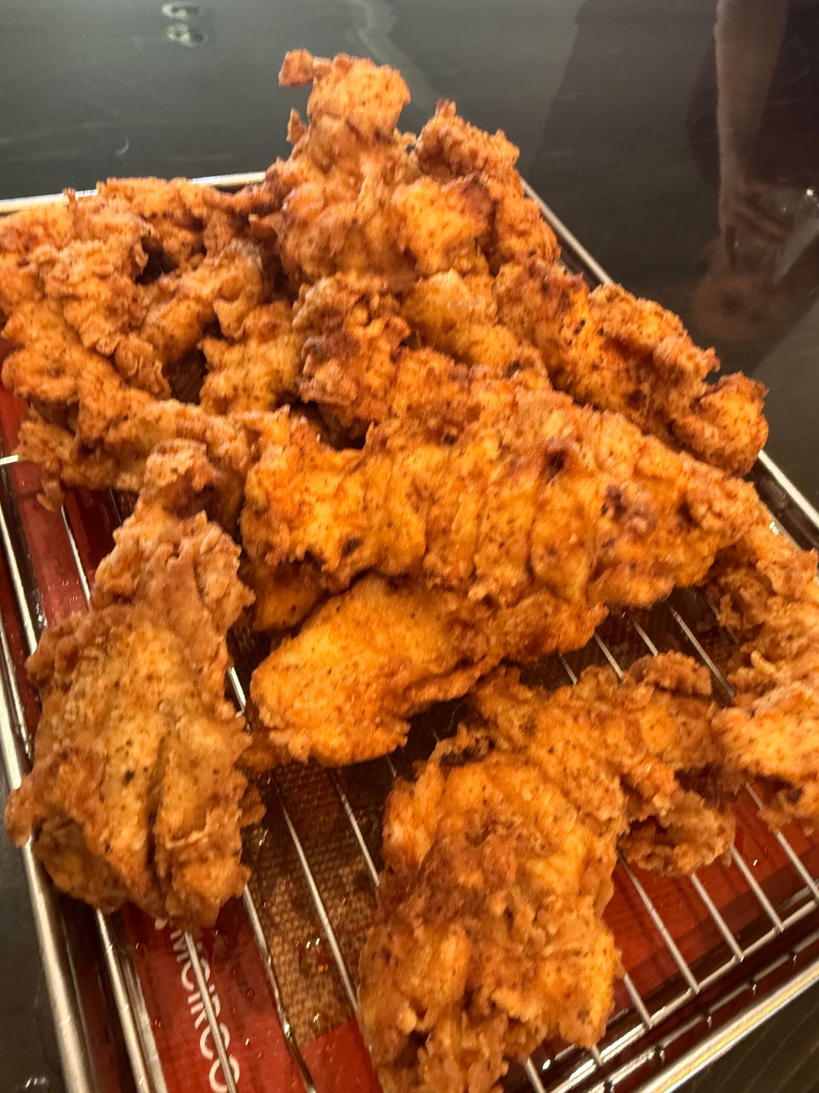 Crispy golden-brown buttermilk fried chicken breasts with a craggy seasoned crust